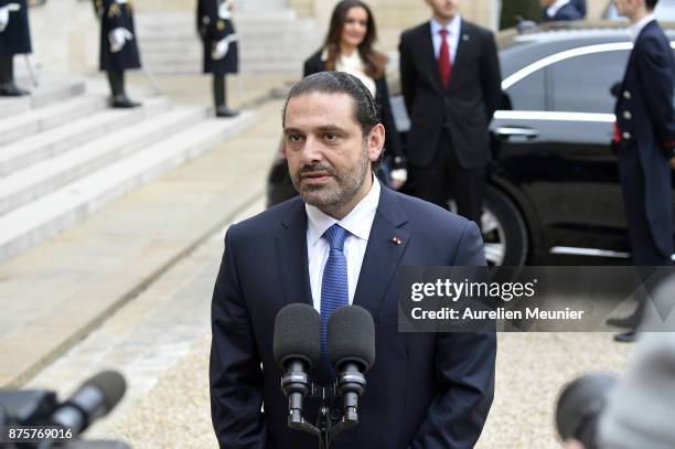 Lebanese Prime Minister Saad Hariri addresses the press as he leaves the Elysee Palace after a meeting with French President Emmanuel Macron on...