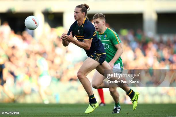 Nathan Fyfe of Australia hand passes the ball during game two of the International Rules Series between Australia and Ireland at Domain Stadium on...