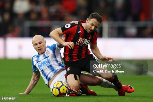 Marc Pugh of AFC Bournemouth and Aaron Mooy of Huddersfield Town compete for the ball during the Premier League match between AFC Bournemouth and...