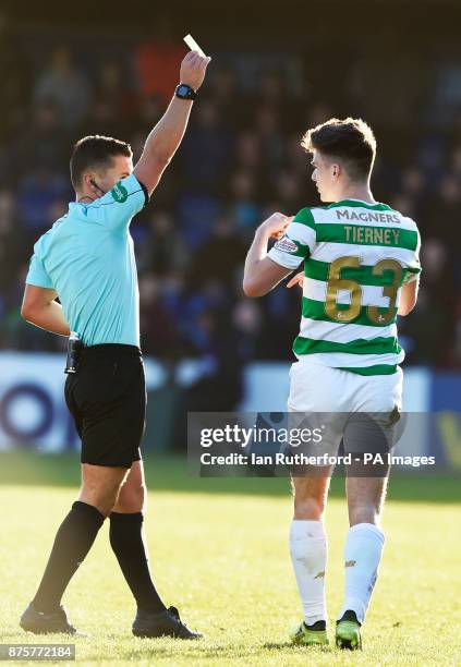 Referee Nick Walsh shows CelticÕs Kieran Tierney a yellow card during the Ladbrokes Scottish Premiership match at the Global Energy Stadium, Dingwall.