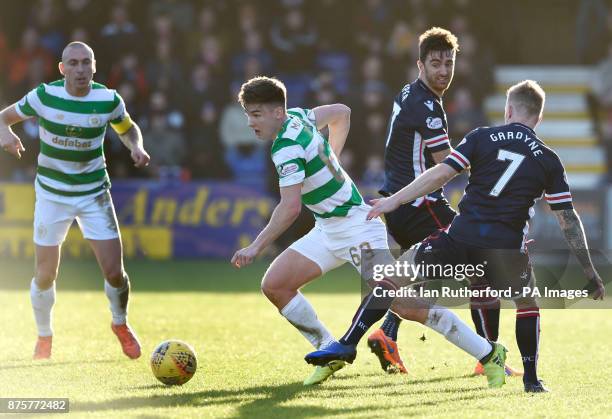 Celtic's Kieran Tierney beats Ross County players Ross Draper and Michael Garden as Scott Brown looks on during the Ladbrokes Scottish Premiership...