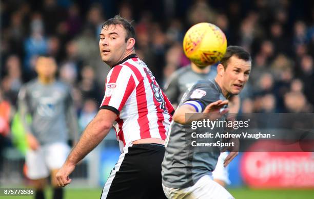 Lincoln City's Matt Rhead vies for possession with Coventry City's Michael Doyle during the Sky Bet League Two match between Lincoln City and...