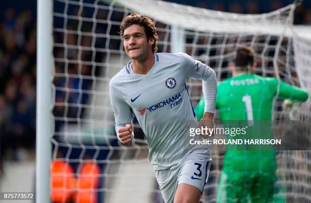 Chelsea's Spanish defender Marcos Alonso celebrates scoring his team's third goal during the English Premier League football match between West...