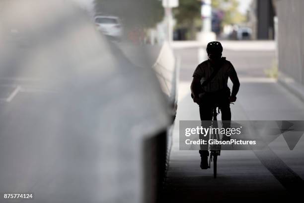 bicycle messenger - dark clothes stock pictures, royalty-free photos & images