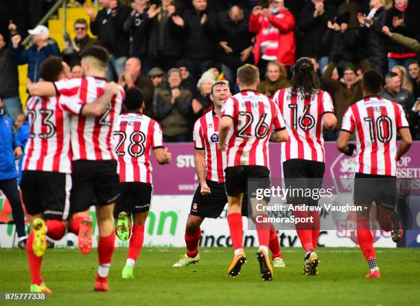 Lincoln City's Matt Rhead celebrates scoring the opening goal during the Sky Bet League Two match between Lincoln City and Coventry City at Sincil...