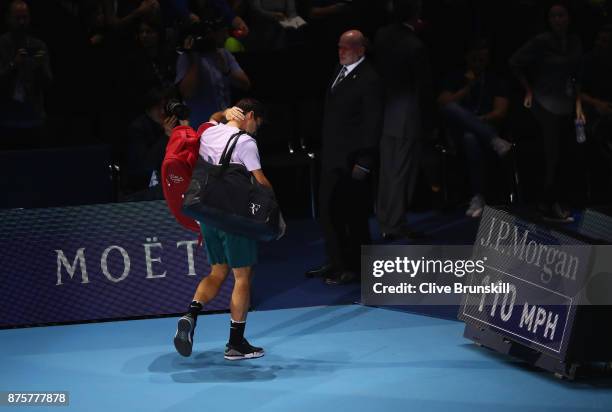 Roger Federer of Switzerland waves goodbye to the crowd after his three set defeat by David Goffin of Belgium in their semi final match the Nitto ATP...