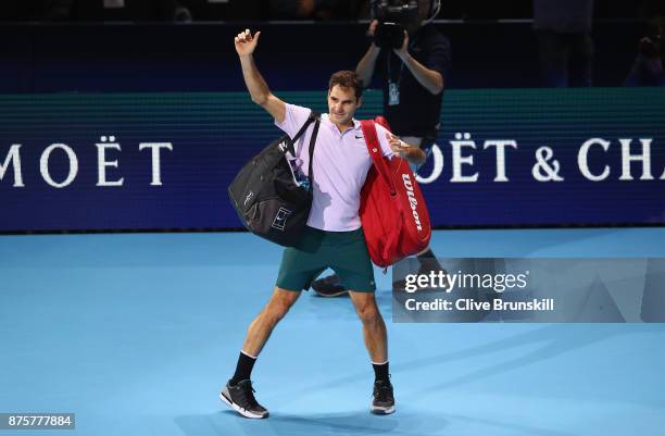 Roger Federer of Switzerland waves goodbye to the crowd after his three set defeat by David Goffin of Belgium in their semi final match the Nitto ATP...