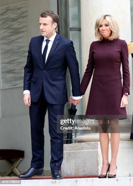 French President Emmanuel Macron and his wife Brigitte accompany Lebanese Prime Minister Saad Hariri at the Elysee Palace in Paris, France on...