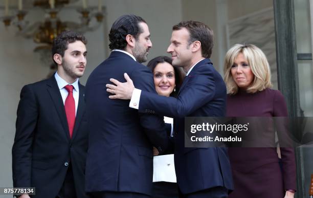 Lebanese Prime Minister Saad Hariri , his wife Lara and their son Hussam leave as French President Emmanuel Macron and his wife Brigitte accompany at...