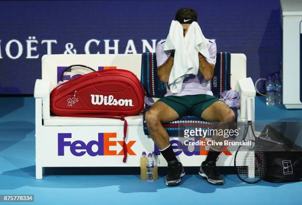 Roger Federer of Switzerland shows his dejection during his three set defeat by David Goffin of Belgium in their semi final match the Nitto ATP World...