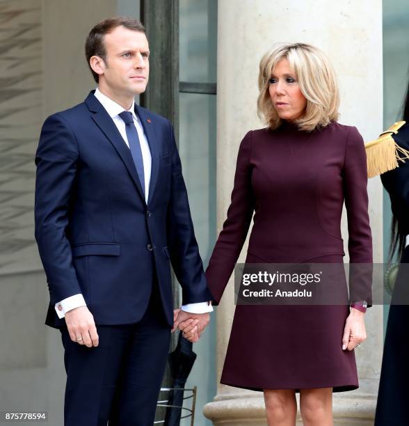 French President Emmanuel Macron and his wife Brigitte accompany Lebanese Prime Minister Saad Hariri at the Elysee Palace in Paris, France on...