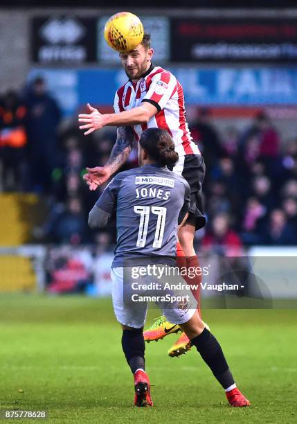Lincoln City's Neal Eardley vies for possession with Coventry City's Jodi Jones during the Sky Bet League Two match between Lincoln City and Coventry...
