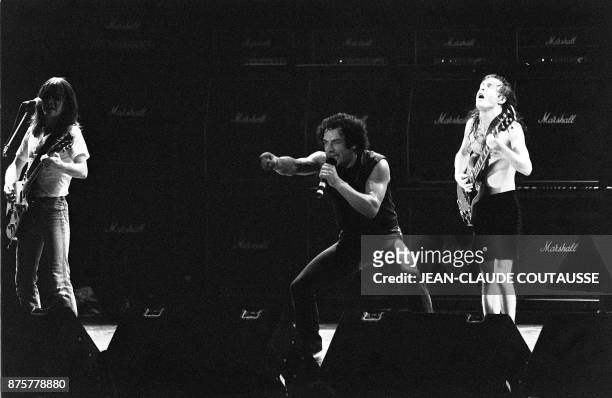 British singer Brian Johnson and guitarists Malcolm Young and Angus Young of Australian legendary hard rock band AC/DC perform at the Palais...