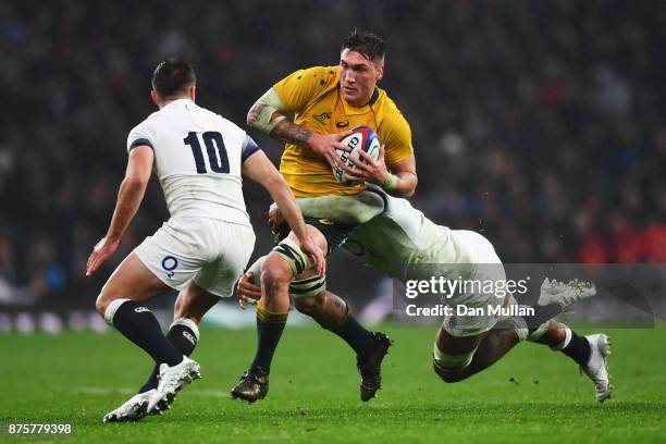 Sean McMahon of Australia is tackled by Courtney Lawes of England during the Old Mutual Wealth Series match between England and Australia at...