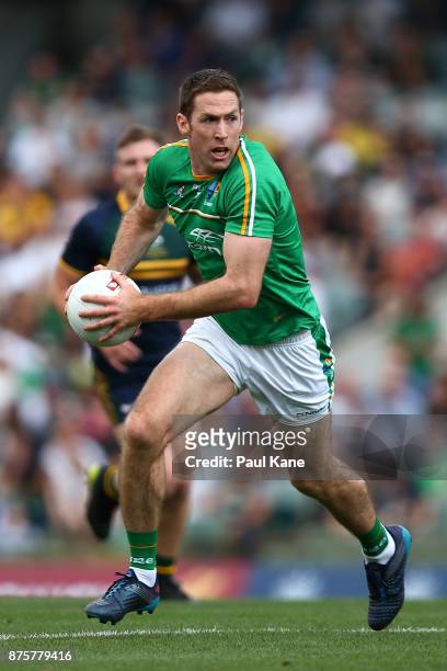 Gary Brennan of Ireland looks to pass the ball during game two of the International Rules Series between Australia and Ireland at Domain Stadium on...