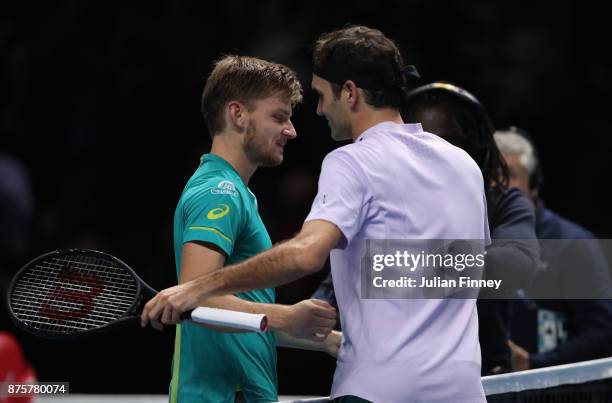David Goffin of Belgium is congratulated by Roger Federer of Switzerland in the semi finals during day seven of the Nitto ATP World Tour Finals...