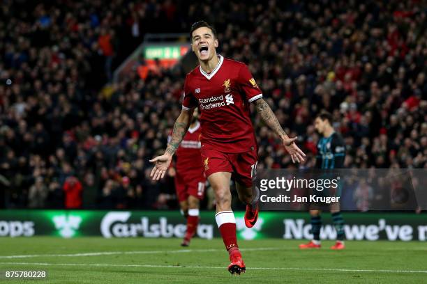 Philippe Coutinho of Liverpool celebrates scoring his side's third goal during the Premier League match between Liverpool and Southampton at Anfield...