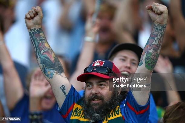 An Australian supporter celebrates after the final siren during game two of the International Rules Series between Australia and Ireland at Domain...