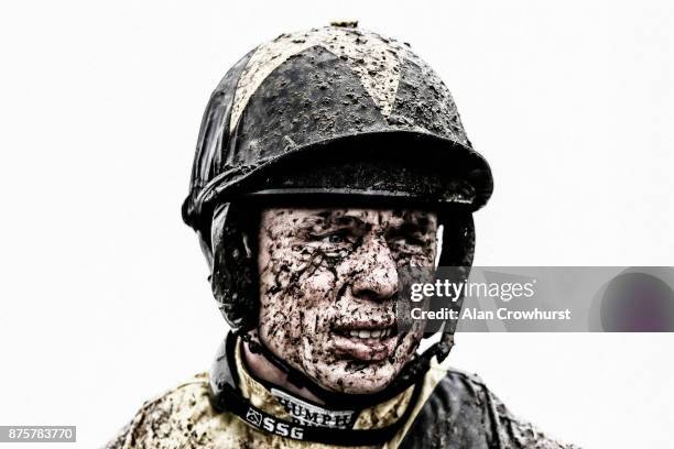 Wet and Muddy Denis O'Regan at Cheltenham racecourse on November 18, 2017 in Cheltenham, United Kingdom.