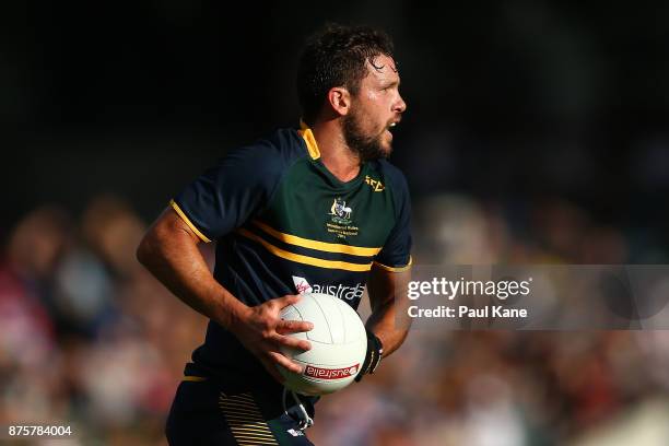 Travis Boak of Australia runs the ball during game two of the International Rules Series between Australia and Ireland at Domain Stadium on November...