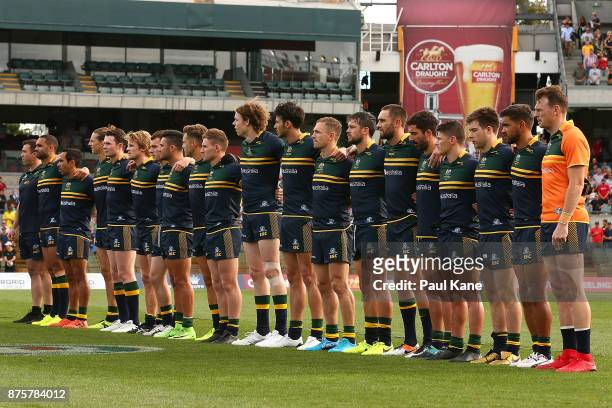 The Australian team line up for the national anthems during game two of the International Rules Series between Australia and Ireland at Domain...