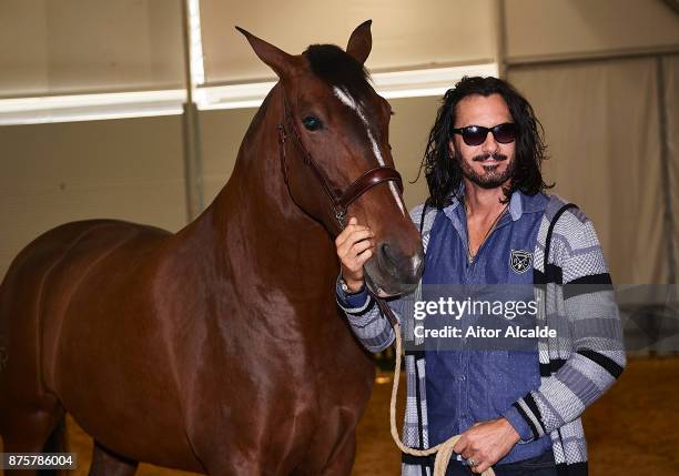 Cuban actor Mario Cimarro attends a guide tour inside the stables prior to the SICAB Closing Gala 2017 on November 18, 2017 in Seville, Spain.