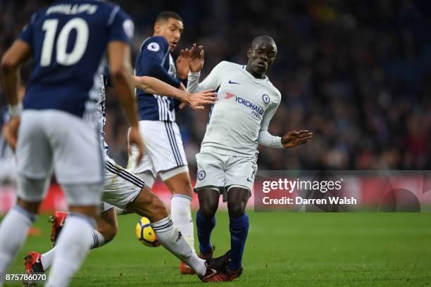 Golo Kante of Chelsea is tackled by Gareth McAuley of West Bromwich Albion during the Premier League match between West Bromwich Albion and Chelsea...