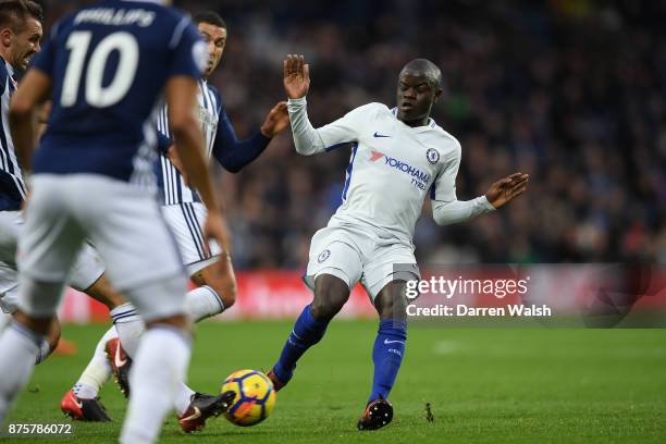 Golo Kante of Chelsea is tackled by Gareth McAuley of West Bromwich Albion during the Premier League match between West Bromwich Albion and Chelsea...