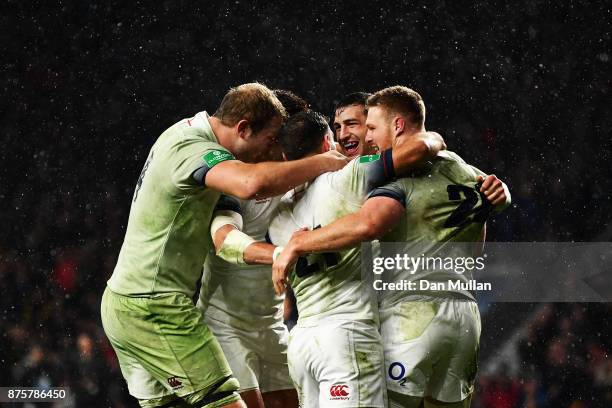 Jonny May of England celebrates scoring his sides third try with team mates during the Old Mutual Wealth Series match between England and Australia...