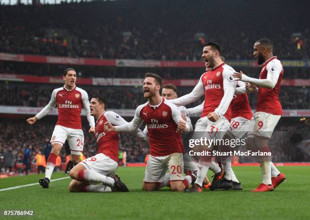 Shkodran Mustafi celebrates scoring the 1st Arsenal goal with Granit Xhaka Sead Kolasinac and Alex Lacazette during the Premier League match between...