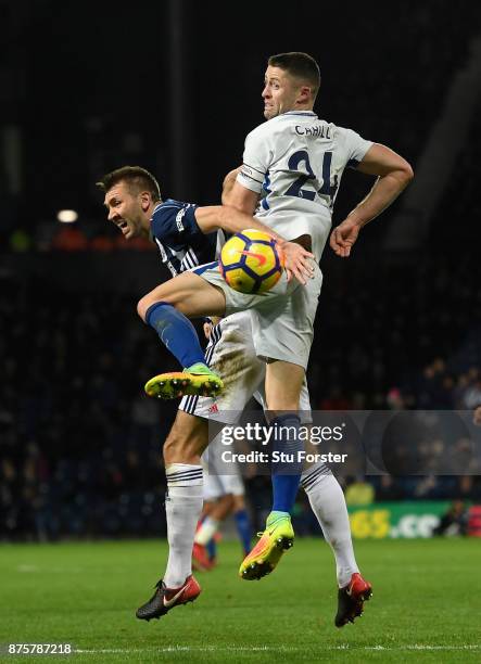 Gary Cahill of Chelsea challenges Gareth McAuley of West Brom during the Premier League match between West Bromwich Albion and Chelsea at The...