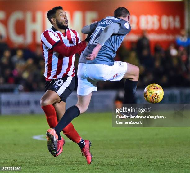 Lincoln City's Matt Green vies for possession with Coventry City's Tom Davies during the Sky Bet League Two match between Lincoln City and Coventry...