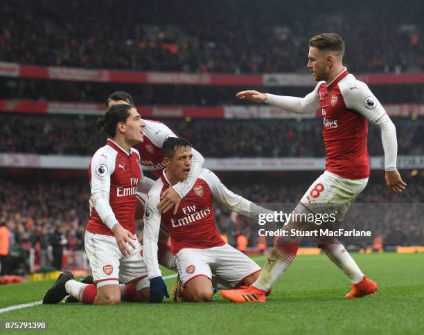 Alexis Sanchez celebrates scoring the 2nd Arsenal goal with Hector Bellerin and Aaron Ramsey during the Premier League match between Arsenal and...