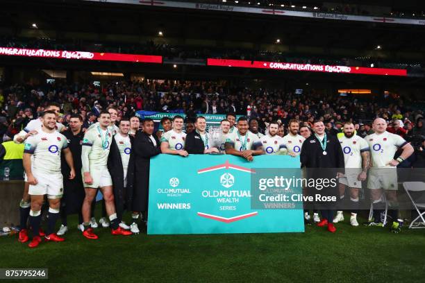 England players pose with the Cook Cup during the Old Mutual Wealth Series match between England and Australia at Twickenham Stadium on November 18,...