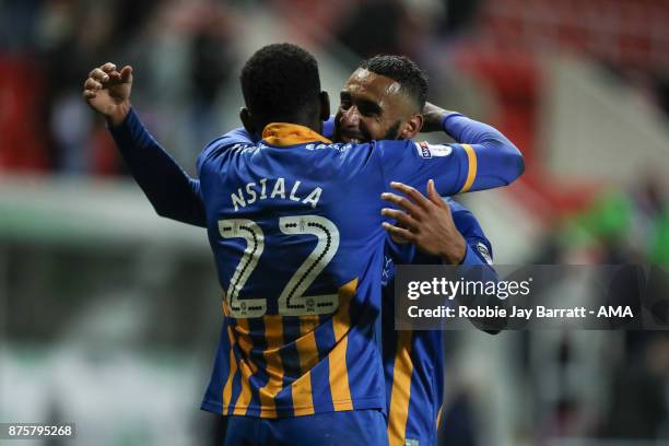 Aristote Nsiala of Shrewsbury Town and Stefan Payne of Shrewsbury Town celebrate at full time during the Sky Bet League One match between Rotherham...