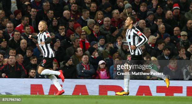 Dwight Gayle of Newcastle United celebrates scoring their first goal during the Premier League match between Manchester United and Newcastle United...