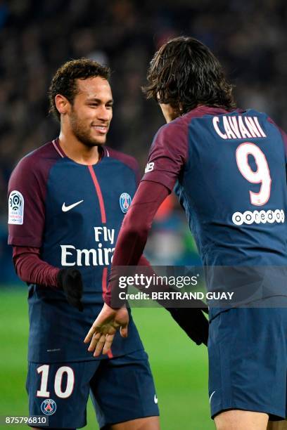 Paris Saint-Germain's Uruguayan forward Edinson Cavani celebrates with Paris Saint-Germain's Brazilian forward Neymar after Cavani opened the scoring...