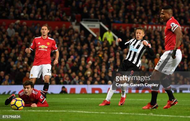 Dwight Gayle of Newcastle United scores his sides first goal during the Premier League match between Manchester United and Newcastle United at Old...
