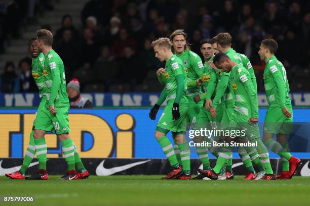 Lars Stindl of Moenchengladbach celebrates with his team mates after he scored to make it 0:1 during the Bundesliga match between Hertha BSC and...
