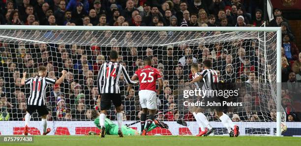 Dwight Gayle of Newcastle United scores their first goal during the Premier League match between Manchester United and Newcastle United at Old...