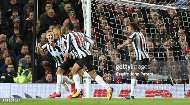 Dwight Gayle of Newcastle United celebrates scoring their first goal during the Premier League match between Manchester United and Newcastle United...