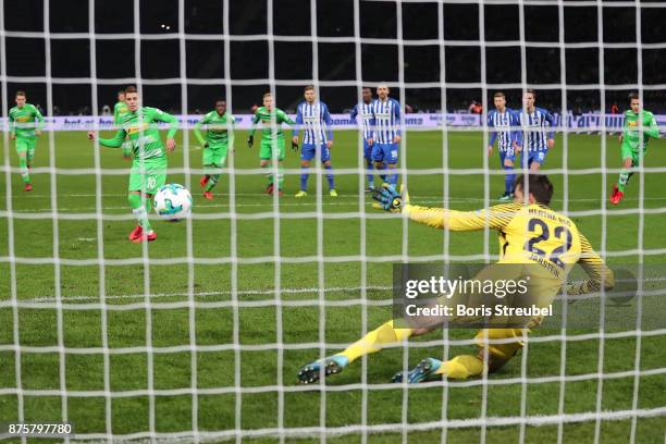 Thorgan Hazard of Moenchengladbach scores a goal from he penalty spot past Rune Jarstein of Berlin to make it 0:2 during the Bundesliga match between...