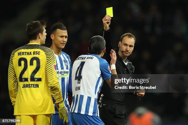 Referee Bastian Dankert awards Moenchengladbach a penalty following video referee check, and shows Karim Rekik of Berlin a yellow card fo a hand...