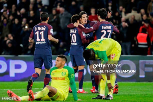 Paris Saint-Germain's Uruguayan forward Edinson Cavani celebrates with Paris Saint-Germain's Argentinian forward Angel Di Maria, Paris...