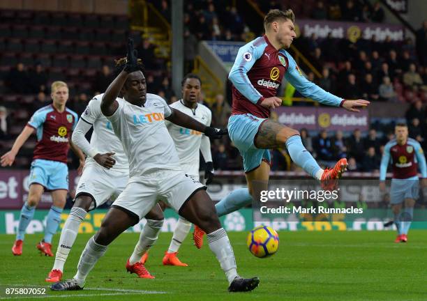 Jeff Hendrick of Burnley is tackled by Wilfred Bony of Swansea City during the Premier League match between Burnley and Swansea City at Turf Moor on...