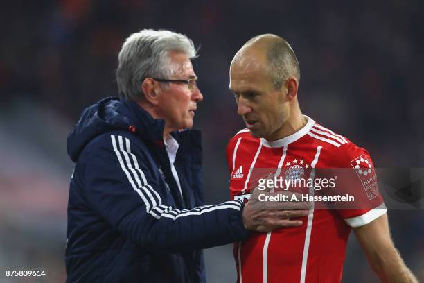 Jupp Heynckes, head coach of FC Bayern Muenchen reacts with his player Arjen Robben during the Bundesliga match between FC Bayern Muenchen and FC...