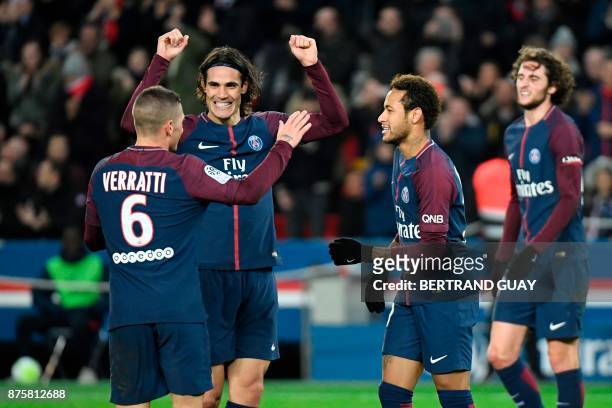 Paris Saint-Germain's Uruguayan forward Edinson Cavani celebrates with Paris Saint-Germain's Italian midfielder Marco Verratti , Paris...