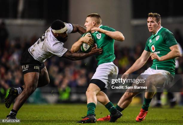 Dublin , Ireland - 18 November 2017; Andrew Conway of Ireland is tackled by Levani Botia of Fiji during the Guinness Series International match...