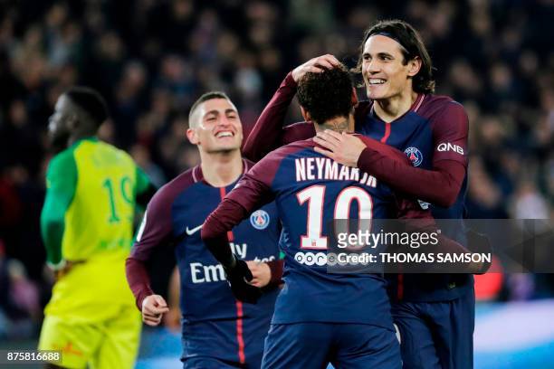 Paris Saint-Germain's Uruguayan forward Edinson Cavani celebrates with Paris Saint-Germain's Italian midfielder Marco Verratti and Paris...