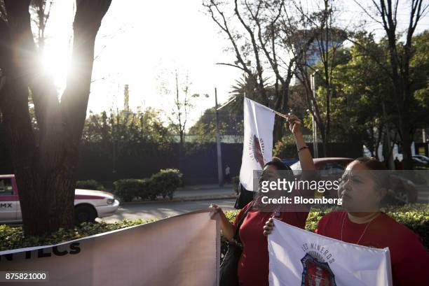 Demonstrators from the mine workers union hold flags during a protest ahead of the North American Free Trade Agreement renegotiations in Mexico City,...